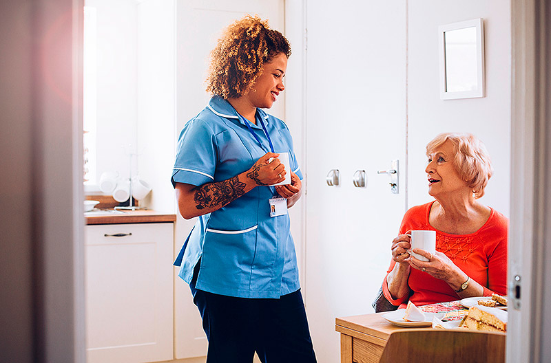 Care worker assisting patient